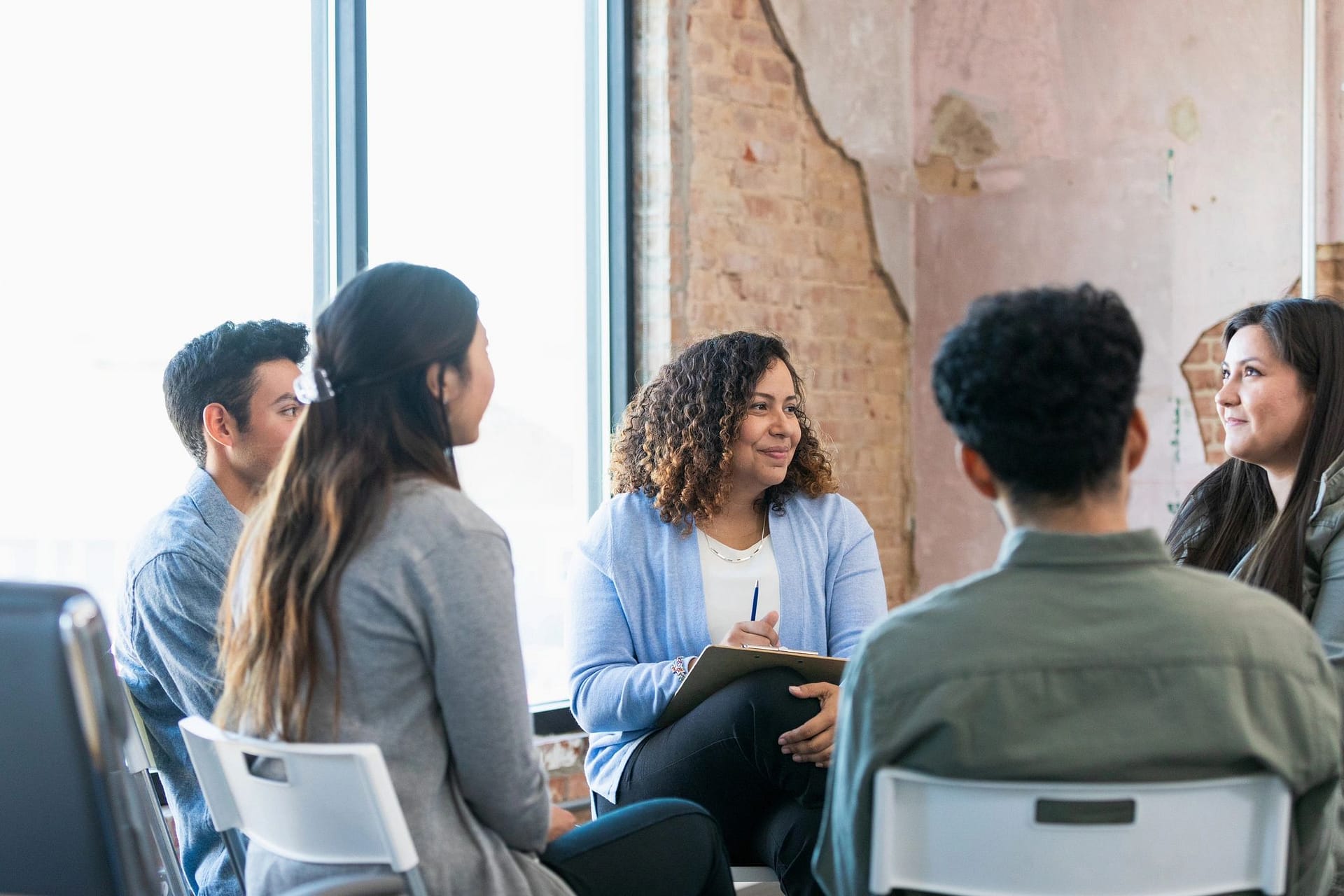 Small group therapy session in a supportive circle