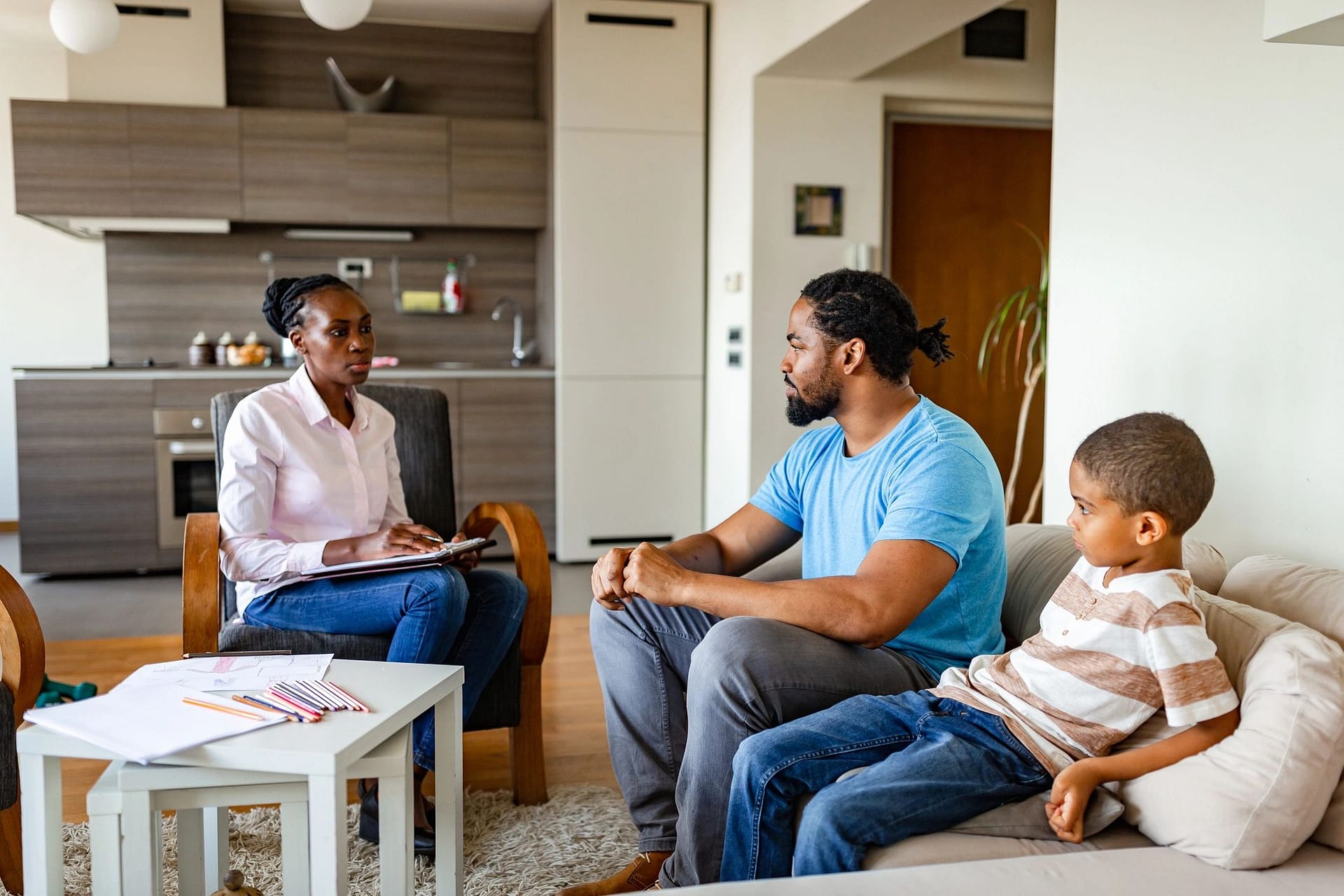 Family therapy session with a therapist and parent
