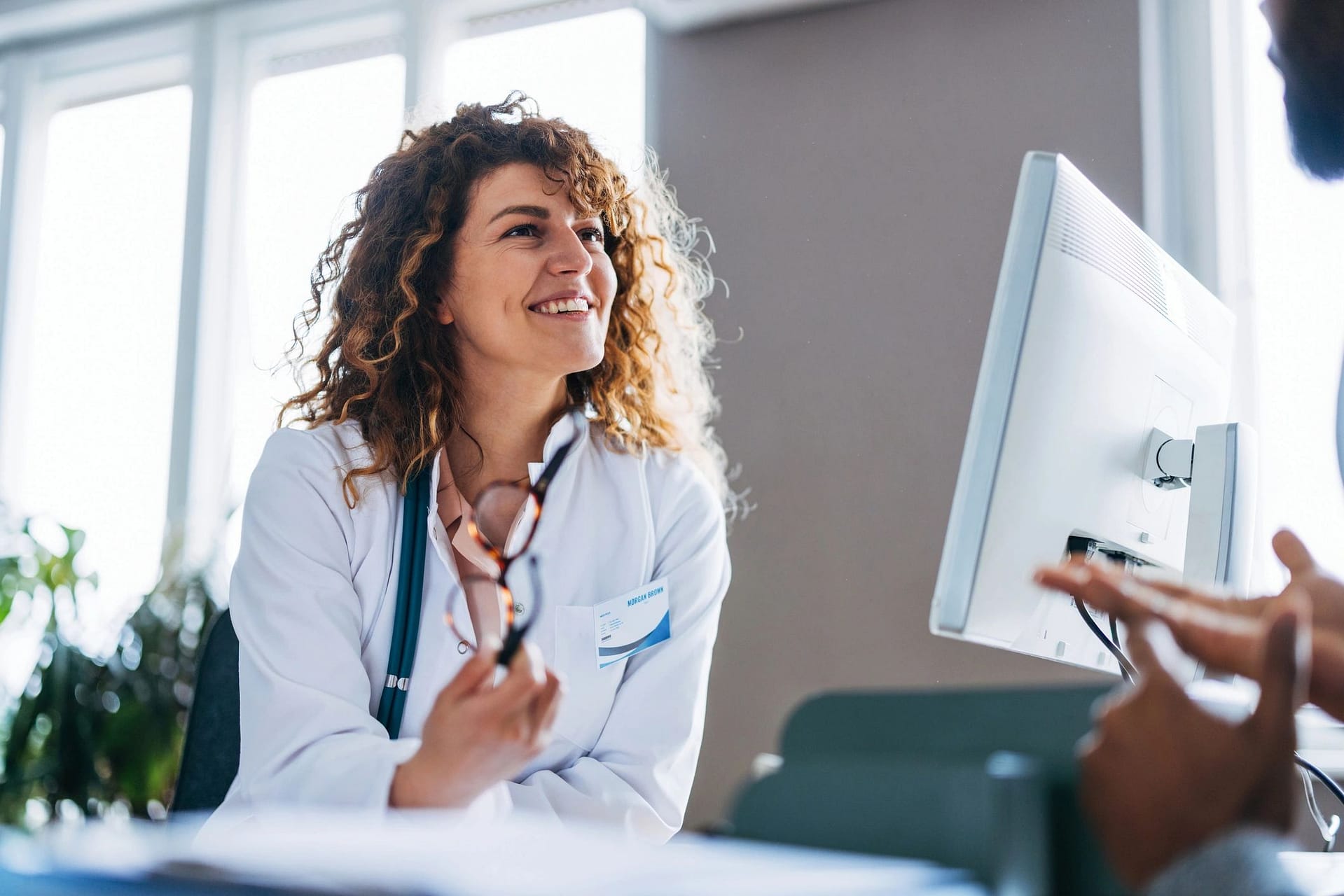 Doctor speaking with a patient during a supportive consultation